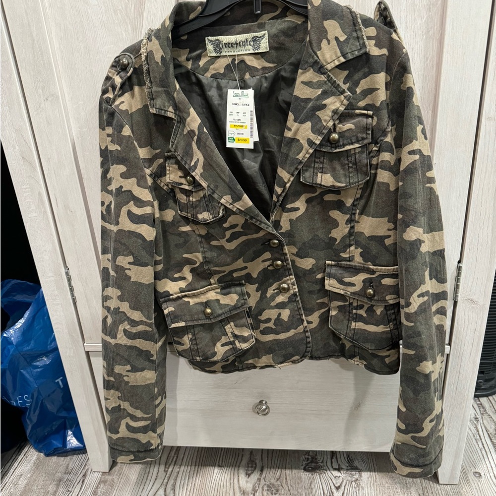 Women’s Size Large camouflage jacket with brass studs.